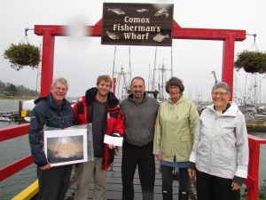Brian Storey (far left) and Barbara Wellwood (far right) accept a generous donation from (l to r) Rob Clarke, Lito Veloso and Elizabeth McLeod of the Comox Valley Harbour Authority. 